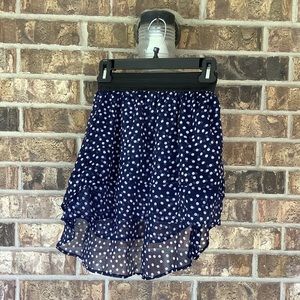 Asymmetrical polka dot navy blue skirt.
